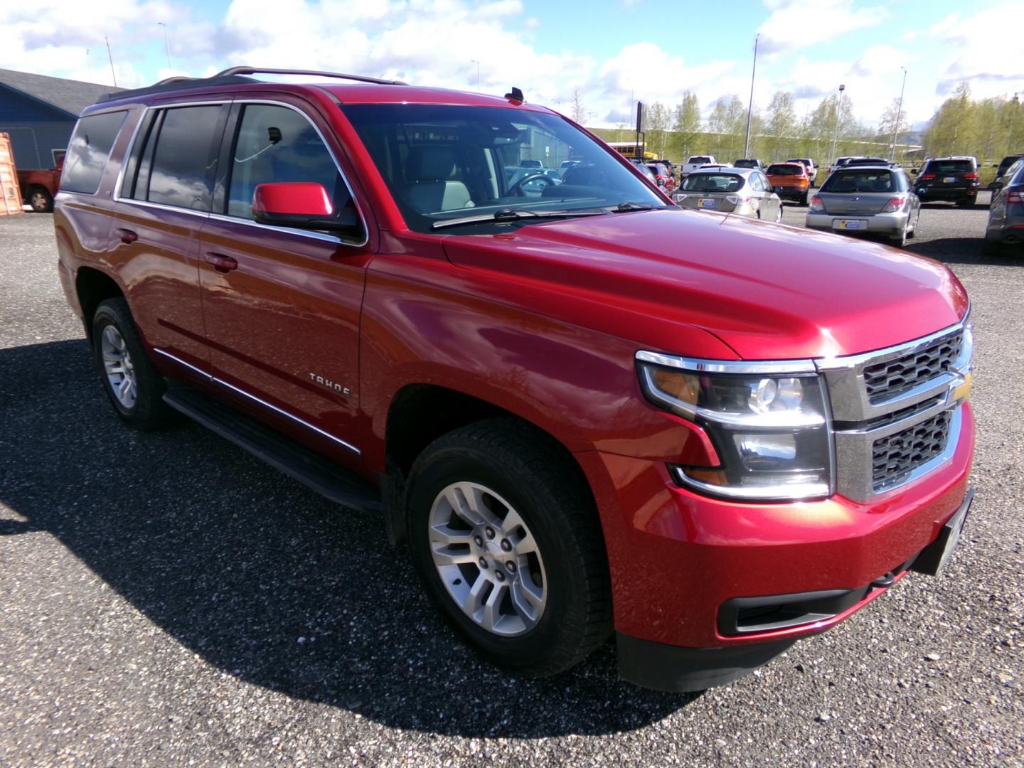 2015 Red Chevrolet Tahoe LT 4WD (1GNSKBKC8FR) with an 5.3L V8 OHV 16V engine, 6-Speed Automatic transmission, located at 2630 Philips Field Rd., Fairbanks, AK, 99709, (907) 458-0593, 64.848068, -147.780609 - Photo#0